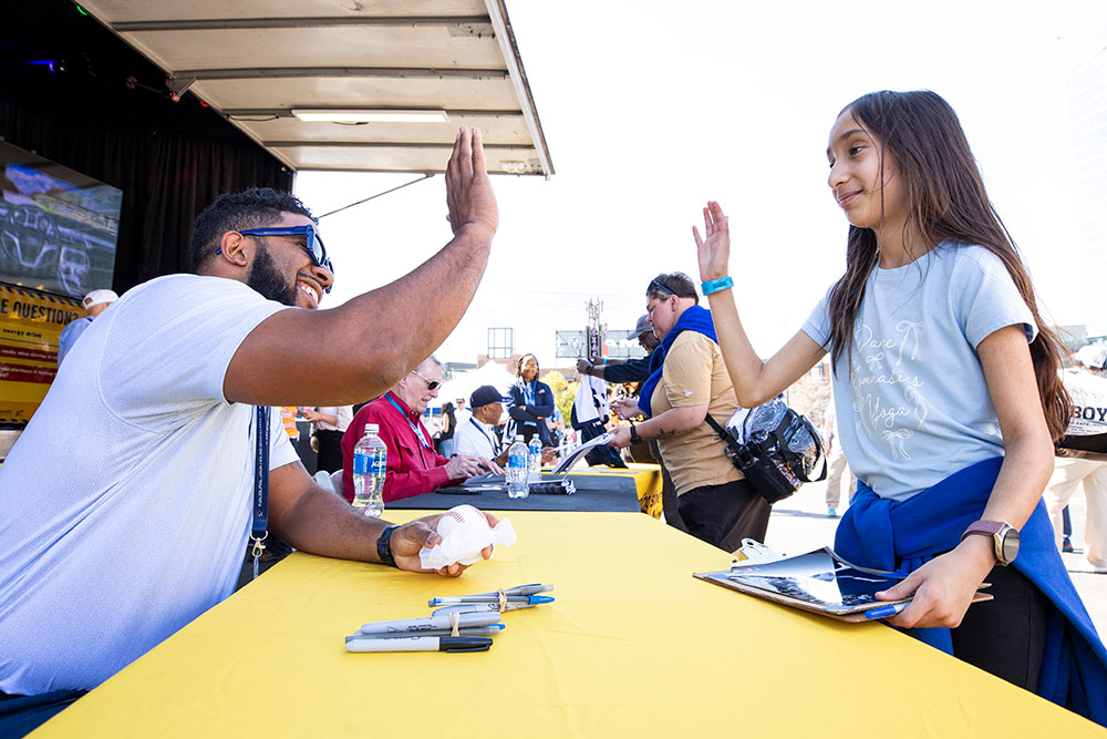 A fan high-fives a player