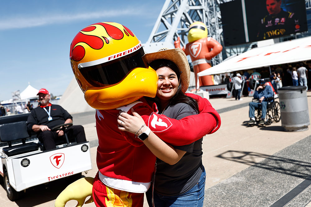 A fan hugs Firehawk