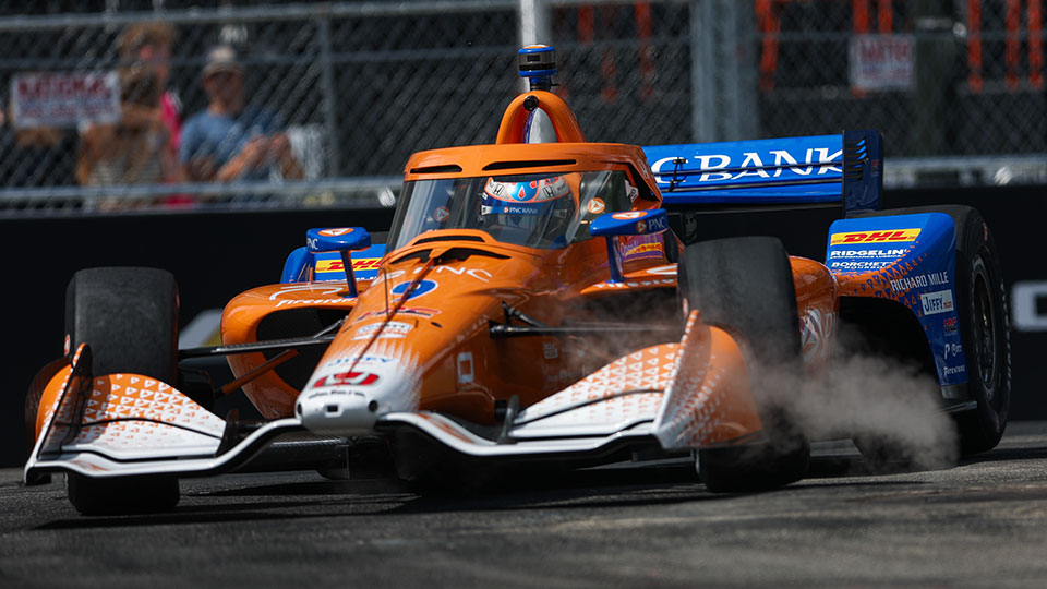 Scott Dixon drives on a roadcourse