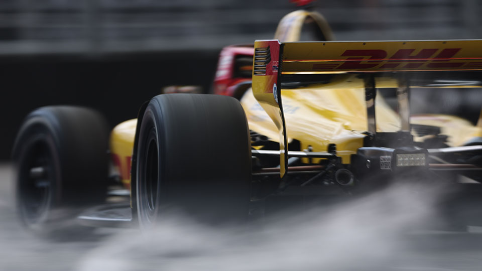 Alex Palou drives on a road course.