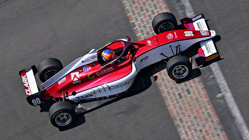 A USF Pro 2000 car crosses the finish line