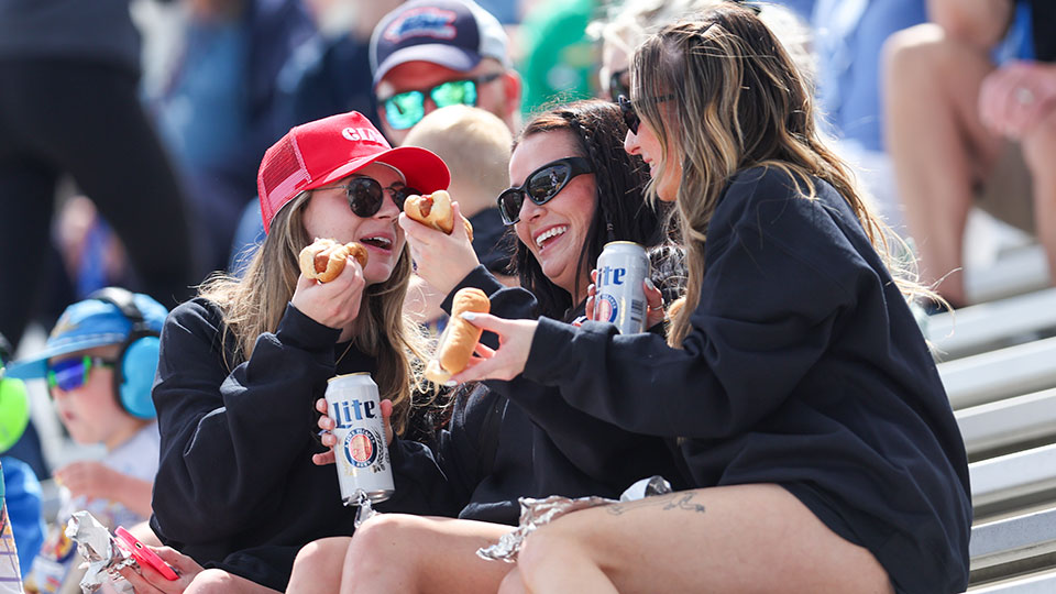Women enjoy food at a race
